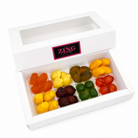The Orchard Collection curated fruit candy gift box open on white background